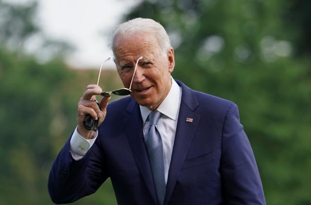 U.S. President Joe Biden removes his sunglasses upon his return to the White House in Washington, U.S., July 7, 2021. REUTERS/Kevin Lamarque