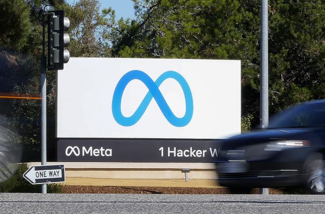 FILE - A car passes Facebook's new Meta logo on a sign at the company headquarters on Oct. 28, 2021, in Menlo Park, Calif. For the first time in a year, the big companies in the S&P 500 may be seeing their profits grow again. The company has been focusing on keeping costs lower, and Wall Street also expects its revenue growth accelerated during the latest quarter. (AP Photo/Tony Avelar, File)