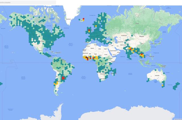 World map with darker green spots in some areas.