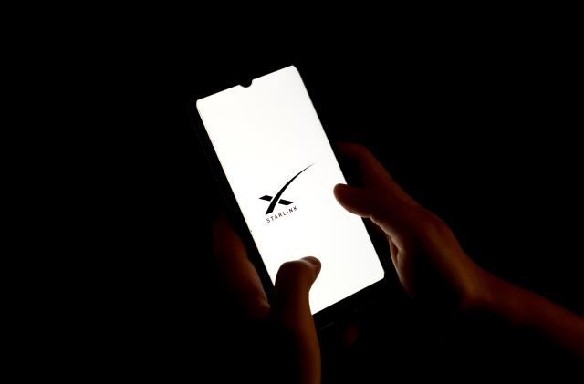 In this photo illustration a Starlink logo seen displayed on a smartphone screen in Chania, Greece on August 15, 2023. (Photo illustration by Nikolas Kokovlis/NurPhoto via Getty Images)