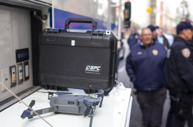 BROOKLYN, NEW YORK - MARCH 19: New York Police Department's Deputy Chief, Robert Lukach, extreme right, speaks to members of the media following a five-hour standoff inside an apartment building in Brooklyn, New York on March 19, 2019. A Mavic drone (center left) was used to see inside the 8th floor apartment. A mentally unstable man holding a fake plastic pistol was taken into custody by a NYPD special hostage team police officer. (Photo by Robert Nickelsberg/Getty Images)