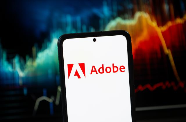 POLAND - 2023/10/24: In this photo illustration a Adobe logo seen displayed on a smartphone. (Photo Illustration by Mateusz Slodkowski/SOPA Images/LightRocket via Getty Images)